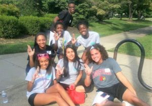 MLK Scholars at a community service event at Iroquois Park. Back row standing: Nuri Thompson. Middle row: Erica Gaither, Noela Botaka, Manuela Botaka. Front row: Taylor Hinna Williams, Elizabeth Peña, Elijah Ervin.