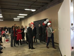UofL leaders and financial supporters take a sledgehammer swing to mark the start of renovation.