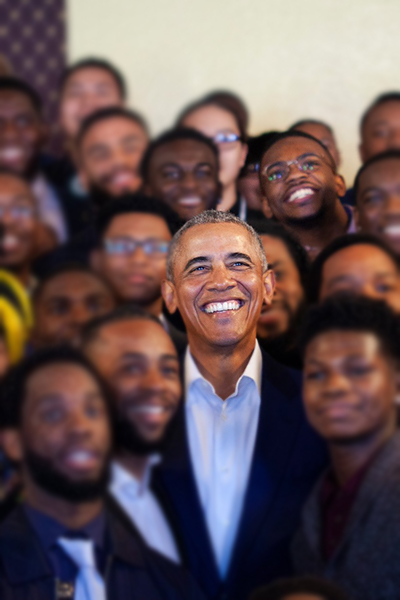 Former President Barack Obama poses for picture with Quintez Brown and MBK Rising participants in Oakland, California.