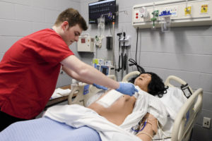 Cody Swift learns clinical skills in the simulation lab.