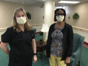 Angela Leinenbach, DNP, APRN, AGPCNP-BC, assistant professor, UofL School of Nursing;  UofL Trager Institute and Republic Bank Foundation Optimal Aging Clinic,  and Renicka Summers, a nurse at Presbyterian Homes, wearing the smart glasses