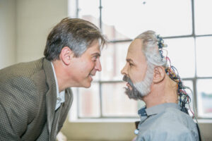 Robotics researcher Dan Popa, Ph.D., with one of his robots