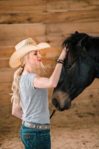 Elizabeth James, Ph.D., with her horse, Ozzie. (Photo by Dan James)