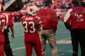 Kathryn Klope vanTonder awaits her opportunity in full uniform to play in a football game in the old Cardinal Stadium.