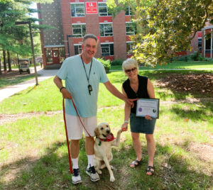 Dr. Bob Buchanan and Dr. Rhonda Buchanan with their dog Jake.
