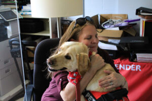 Jan Rayburn gives Jake a hug.