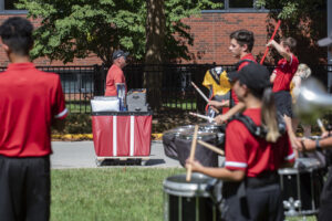 A mini marching band greets incoming students.