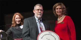 Al Saylor, RN, one of the 2014 Florence Nightingale Award winners, with his plaque