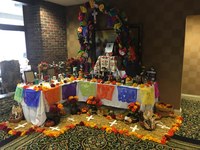 The LALS students set up an altar at Hotel Louisville, 120 W. Broadway, where employees and residents put photos and mementos to honor their loved ones; the display also pays tribute to homeless people who perish because they lack shelter.