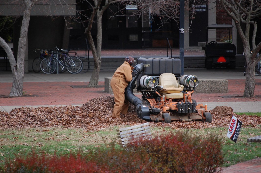 A UofL worker cleans the grounds. In 2013, UofL was the first public university in Kentucky to guarantee a living wage to its employees.
