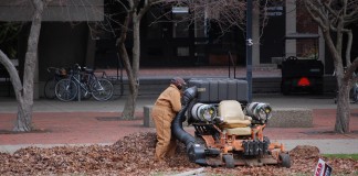 A UofL worker cleans the grounds. In 2013, UofL was the first public university in Kentucky to guarantee a living wage to its employees.