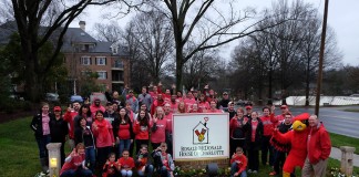 Volunteers at the site of the 2014 community service project prior to the Belk Bowl.