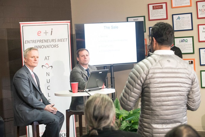 David Durik and Phil Hawkins, founders of Indatus Corp., listen to a question from the audience at the Entrepreneurs Meet Innovators (e+i) program Dec. 3.