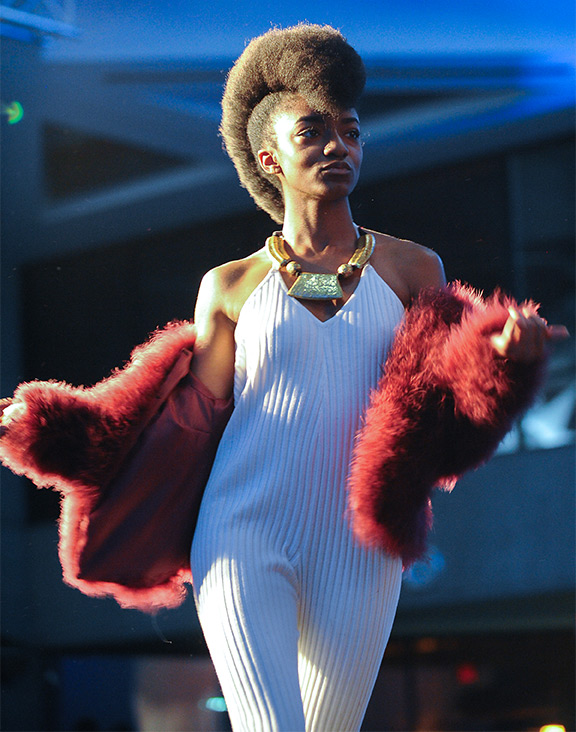 A model on the runway at the 2015 International Fashion Show.