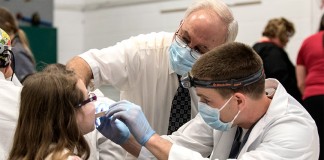 Children receive free dental screenings and oral health education