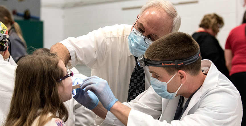 Children receive free dental screenings and oral health education