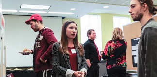 UofL student Elizabeth Kloenne explains her undergraduate research project to the UofL community.