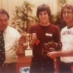 Ellis Mendelsohn hands over the Turtle Derby trophy to two participants, including John Smith (right), now assistant director of intramurals at UofL.