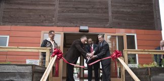 A ribbon cutting ceremony celebrated the Conn Center's solar-powered Phoenix House. From left is Andrew Marsh, asst. director of the Conn Center, Mark McGinley, Speed professor, Mahendra Sunkara, director of the Conn Center, and John Usher, acting dean of the Speed School.