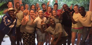 The School of Nursing group that traveled to Haiti earlier this month pose with their translators and drivers.