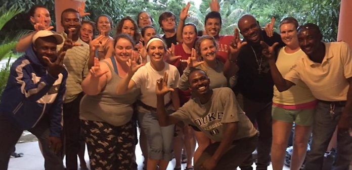 The School of Nursing group that traveled to Haiti earlier this month pose with their translators and drivers.