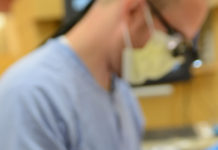 Dental student treats a patient at the School of Dentistry.