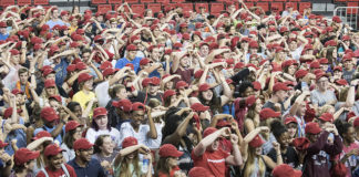 Convocation includes the symbolic issuing of a Cardinals baseball cap, which the freshmen are encouraged to exchange for a graduation cap in four years.