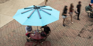 The Powersol table and umbrella will permanently reside in the courtyard at Bettie Johnson Hall.