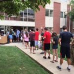 Students line up outside Kurz Hall awaiting room assignments.