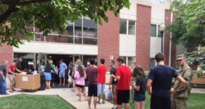 Students line up outside Kurz Hall awaiting room assignments.