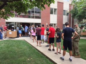 Students line up outside Kurz Hall awaiting room assignments.