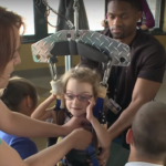 Locomotor training is helping Emmalie, who was unable to walk after suffering a spinal cord injury, take steps, sit up on her own and improve her range of motion.