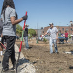 UofL students work on creating a rain garden on campus, one of many initiatives for sustainability.