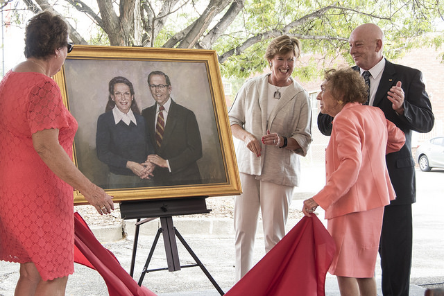 Heddy Kurz unveils a portrait of her and her late husband, Herman Kurz, that will be hung in UofL's new welcome center that bears their name.