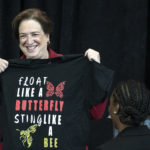 Justice Kagan shows off a t-shirt given to her during her Louisville visit.