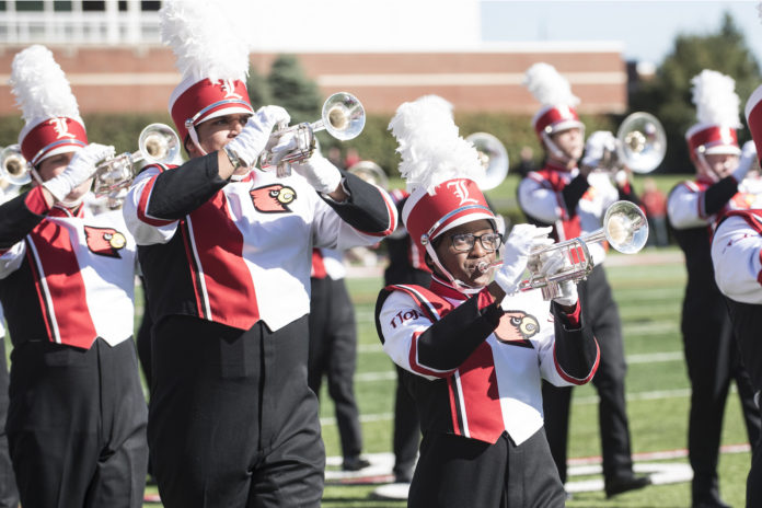 The Cardinal Marching Band shown in a pre-pandemic performance.