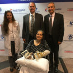 Louella Aker is seated with from left, Christine Kaufman, Ph.D., Stuart Williams, Ph.D., and Tuna Ozyurekoglu, M.D. Aker is the recipient of the first double hand transplant with a woman in Kentucky.