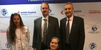 Louella Aker is seated with from left, Christine Kaufman, Ph.D., Stuart Williams, Ph.D., and Tuna Ozyurekoglu, M.D. Aker is the recipient of the first double hand transplant with a woman in Kentucky.