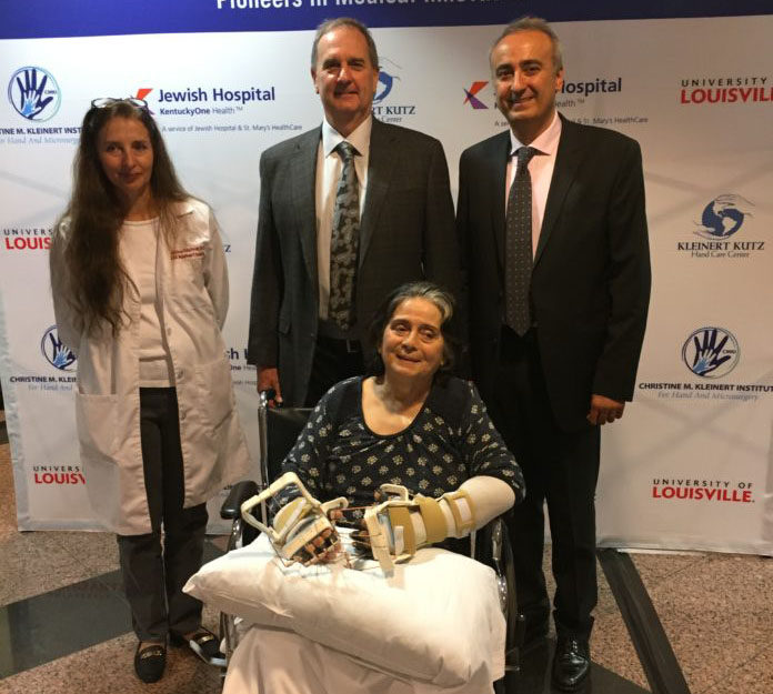 Louella Aker is seated with from left, Christine Kaufman, Ph.D., Stuart Williams, Ph.D., and Tuna Ozyurekoglu, M.D. Aker is the recipient of the first double hand transplant with a woman in Kentucky.