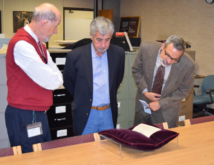 ASC Archivist Tom Owen, donor Guy Montgomery, Dean Robert J. Fox, Jr.