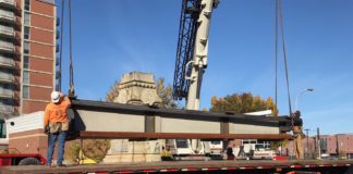 Workers loaded a large section of the confederate monument on a truck during deconstruction of the monument Sunday, nov. 20. The monument will be reassembled in Brandenburg, where it will join other monuments in a historical display.