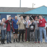 Michael Mardis, (far right) dean of students and vice provost for student affairs, was among the volunteers who spent the afternoon at the Americana Community Center.