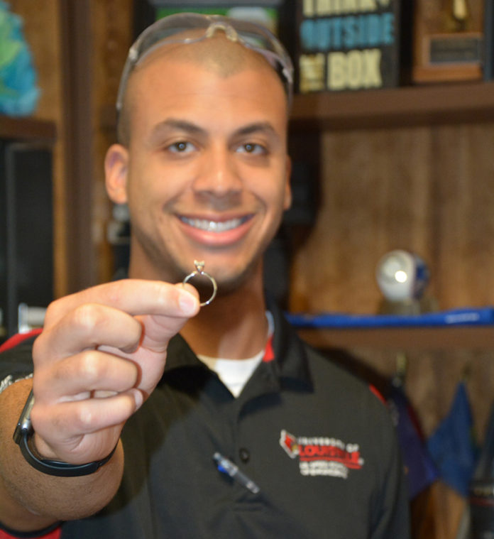 Engineering student Keren Callen shows off a 3-D printed engagement ring he made for his fiance, Maddie Mullikin.