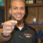 Engineering student Keren Callen shows off a 3-D printed engagement ring he made for his fiance, Maddie Mullikin.