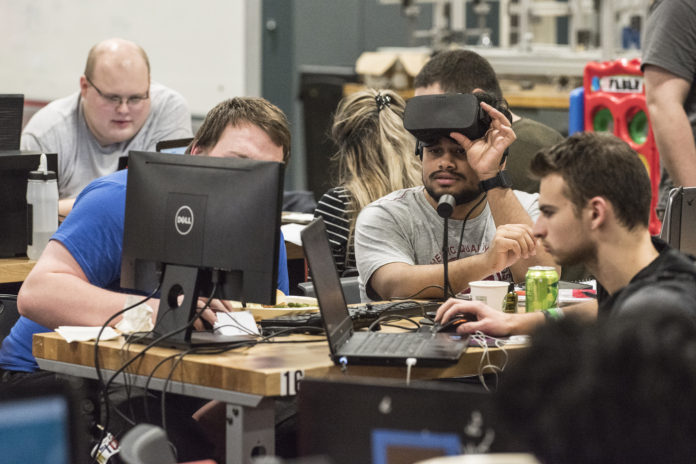 More than 100 hackers spent 36 straight hours at the University of Louisville Engineering Garage, 1960 Arthur St., developing creative software and hardware along the smart cities theme.