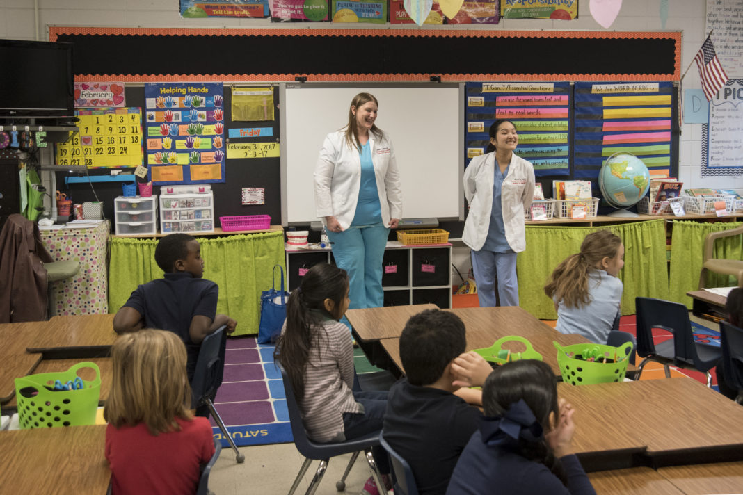 Dental hygiene students teach oral health education.