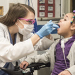 Dental screening on Give Kids a Smile day.