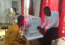 A surplus auto refractor, donated by UofL, is used to determine a patient’s proper eyeglass prescription in Tamale, Ghana