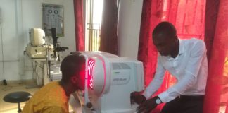 A surplus auto refractor, donated by UofL, is used to determine a patient’s proper eyeglass prescription in Tamale, Ghana