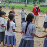 ISLP participants work with students during a previous ISLP trip.